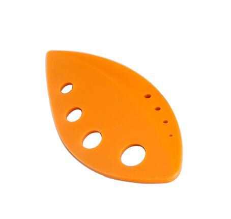 Herb stripper leaf tool in vibrant orange with multiple size holes for easy herb removal.