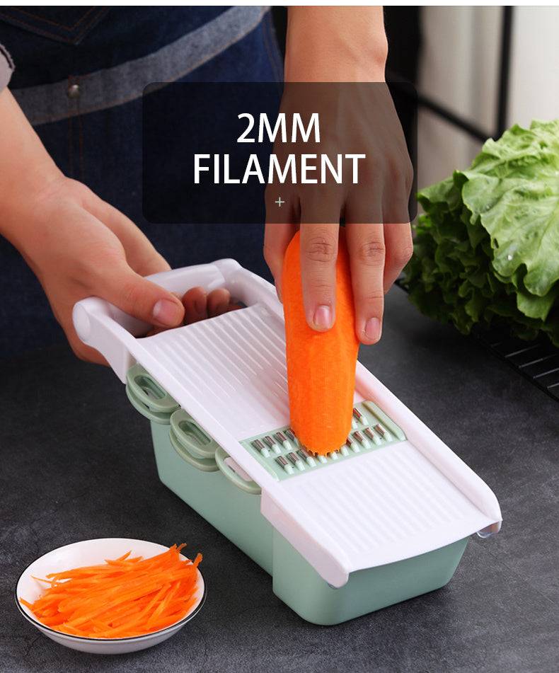 Multifunctional kitchen utensil demonstrated as a vegetable slicer grating a carrot.