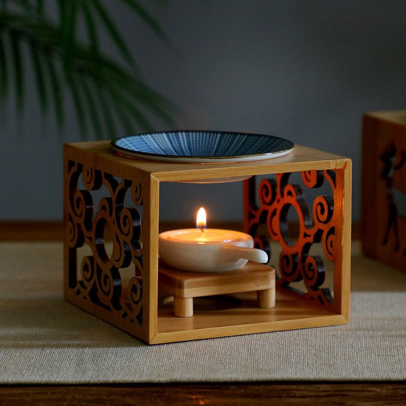 Bamboo candle lamp with ceramic oil dish for aromatherapy.