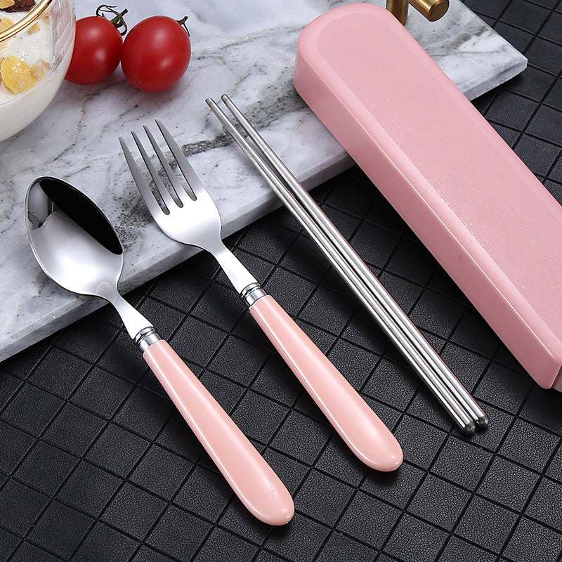 Portable Nordic Tableware Set on a Dark Surface with Pink Handles