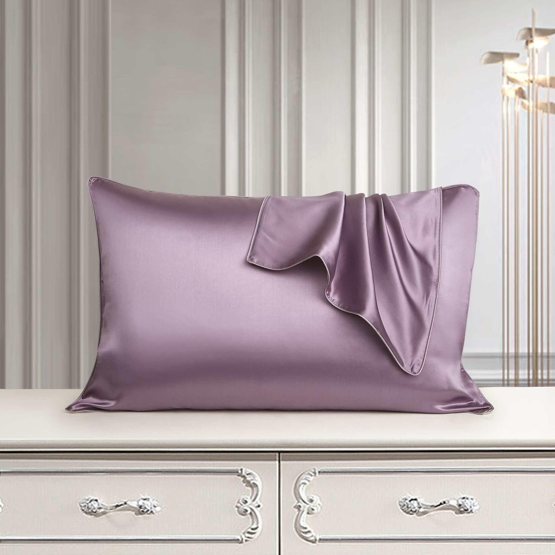 Luxury mulberry silk pillow case in palace style on elegant dresser.
