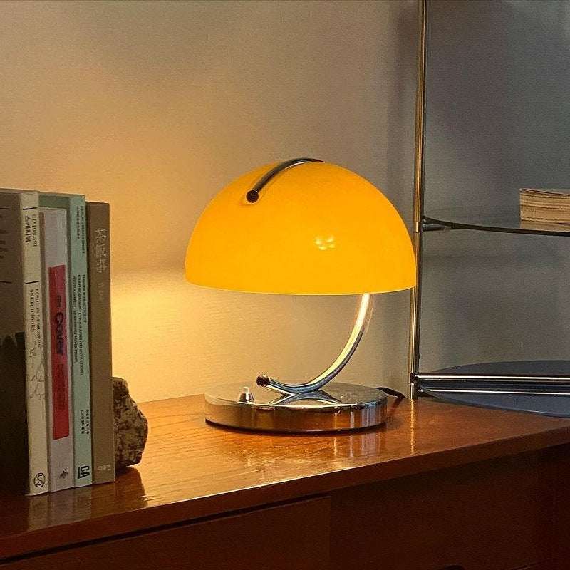 Retro Space Age Table Lamp with yellow glass shade on a wooden table.