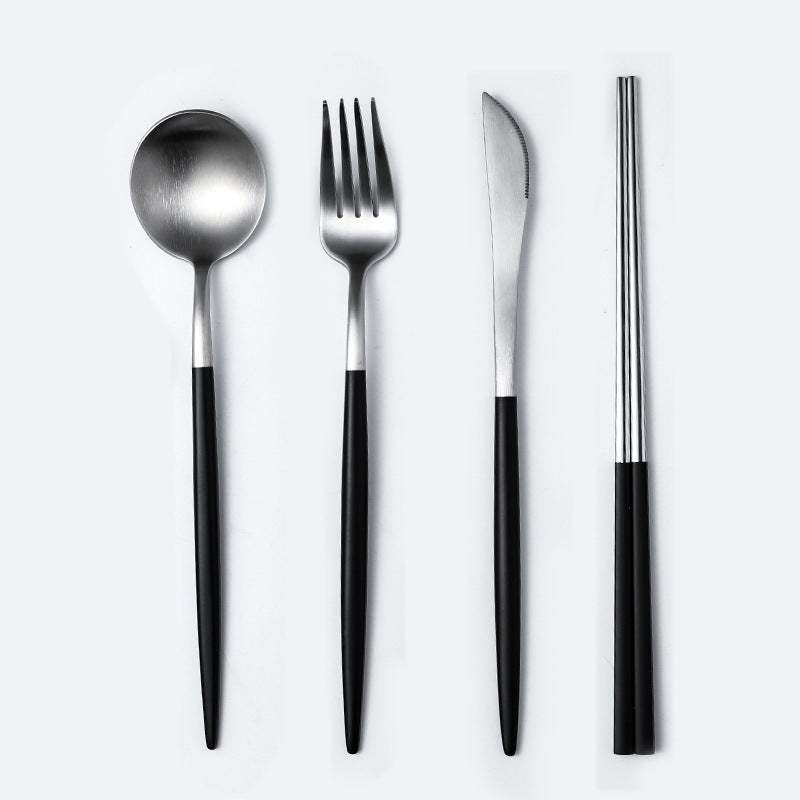 Stainless steel cutlery spoon set with polished finish, including spoon, fork, knife, and chopsticks.