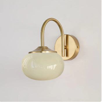 Cream style chandelier with wrought iron and glass design for bedroom use.