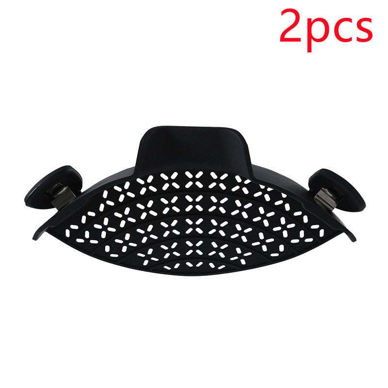 Black silicone pot side drain stopper with stainless steel, modern minimalist design.