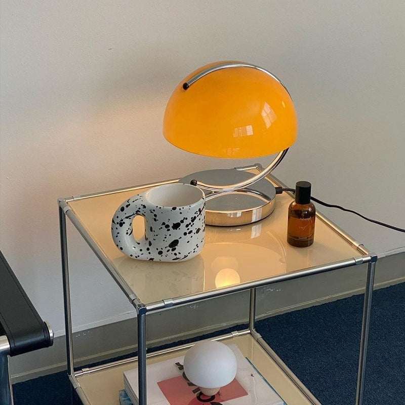 Retro Space Age Table Lamp on modern metal side table near decorative mug and bottle.