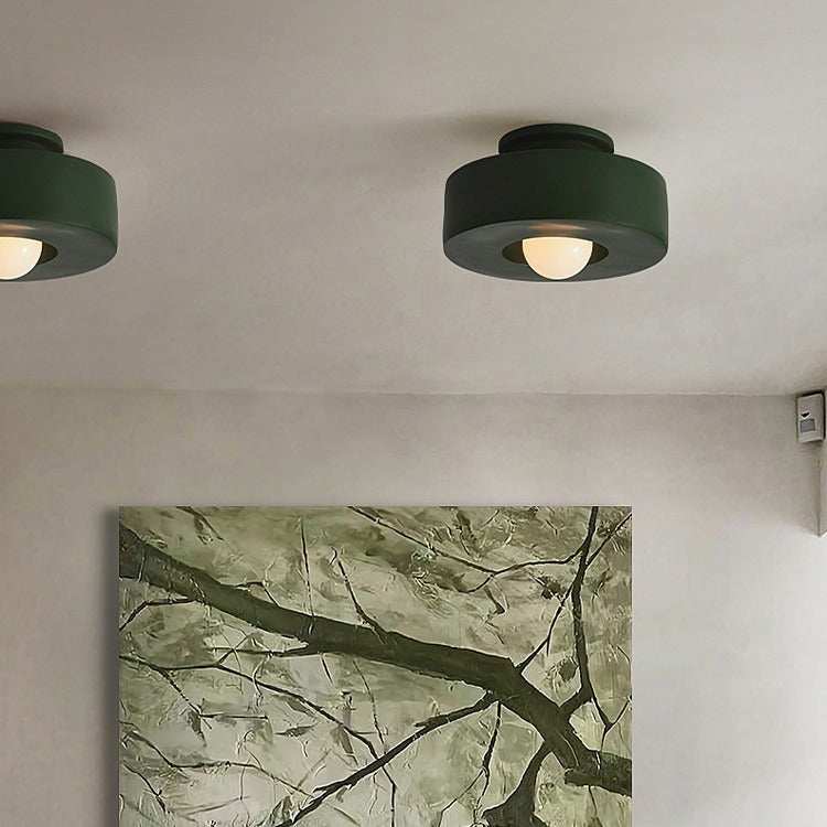Nordic minimalist ceiling mounted lighting fixture in a bedroom setting.