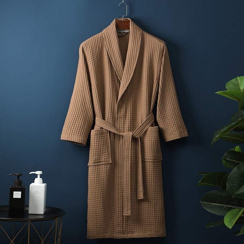 Pure cotton waffle bathrobe in dark coffee color, hanging on a hook.