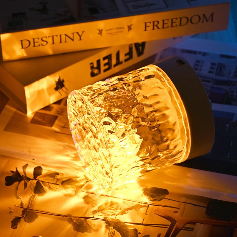 Modern water ripple rotating night light with tricolor projection, acrylic shade, and remote control.  