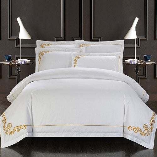 Four-piece cotton bedding set with plain design and intricate embroidery, made from high-quality pure cotton with a twill weave.