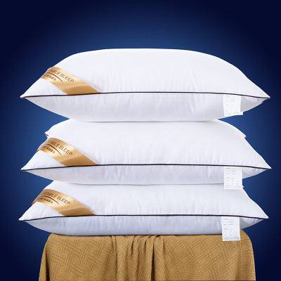 Five-star hotel pillow with protective core, rectangular shape, polyester fiber filling, stacked on a beige surface.