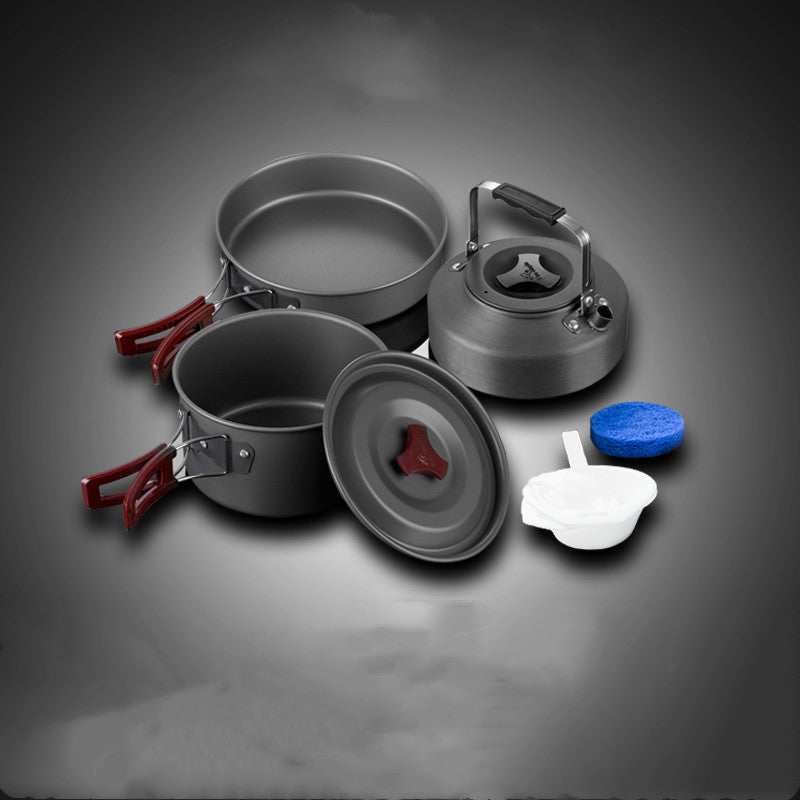 Picnic cookware set including hard alumina pots and pan with accessories.