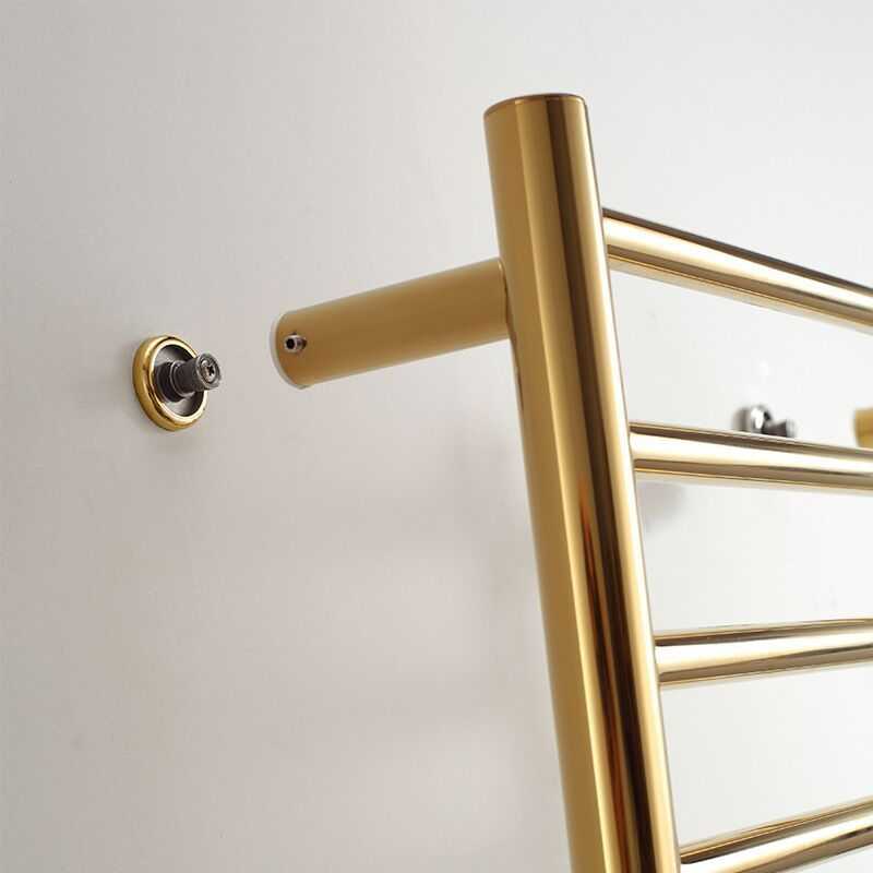 Stainless steel heated towel rack with modern minimalist design and gold finish.