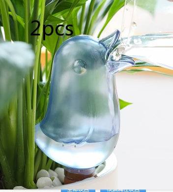 Bird-shaped potted plant waterer spike providing automatic watering to houseplants.