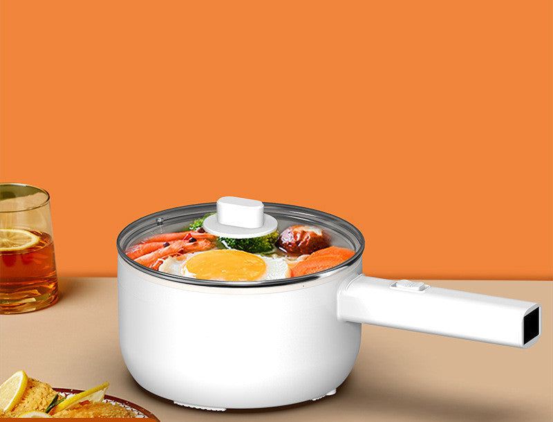 Multifunctional electric cooker with glass lid, filled with cooked vegetables and eggs, on an orange background.