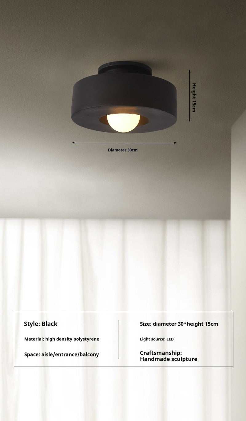 Nordic minimalist ceiling mounted light fixture with a black finish, suitable for bedrooms and dining rooms.
