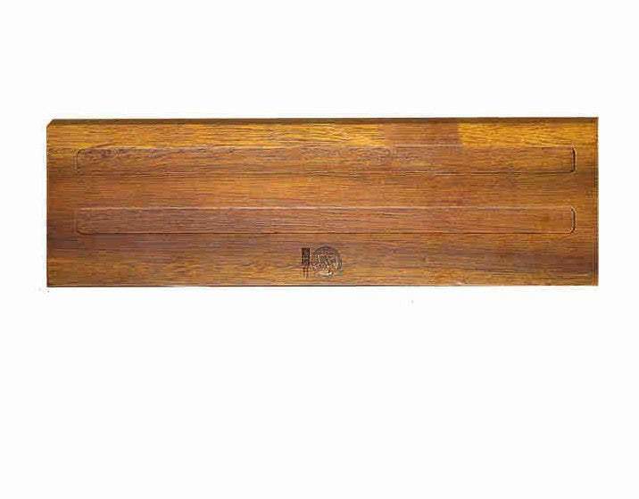 Wall-mounted solid wood magnetic kitchen knife rack for easy knife storage.