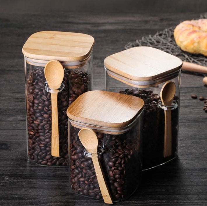 Japanese style glass kitchen food storage cans with wooden lids and spoons, square shape, 800-1000ml capacity.