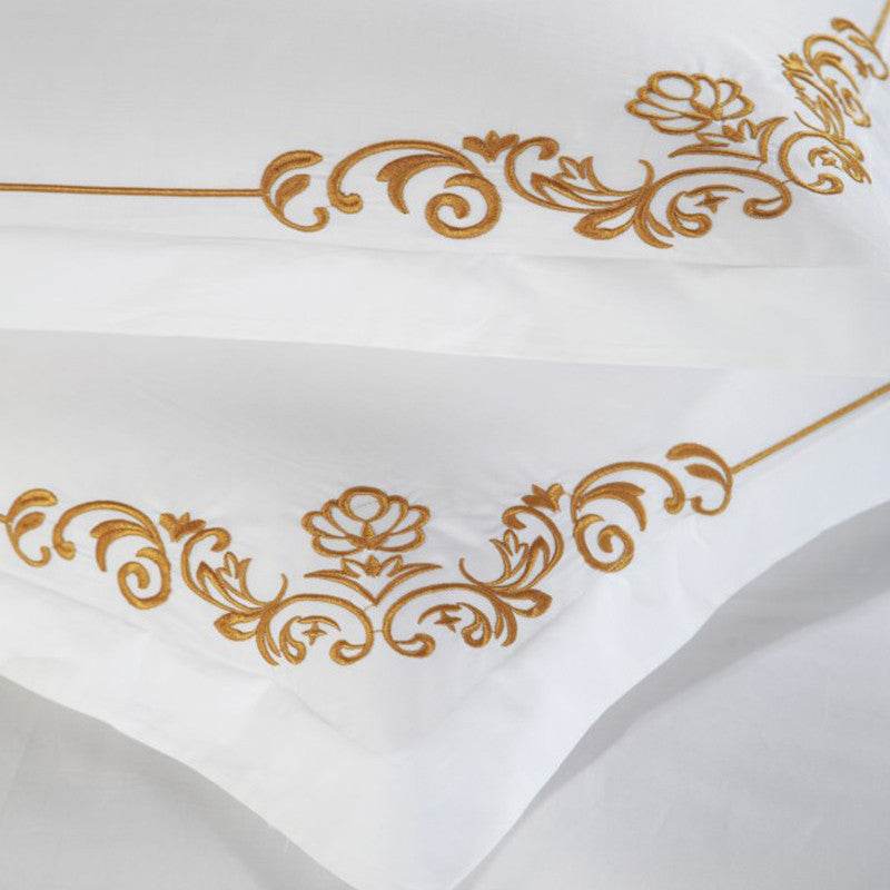 Embroidered pillowcase from four-piece cotton bedding set.