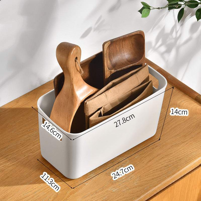 Plastic kitchen cabinet organizer storage box on a wooden surface, displaying dimensions and holding wooden kitchen utensils.