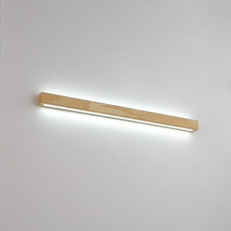 Nordic style bedroom bedside background wall strip lamp with white log finish, emitting white light.
