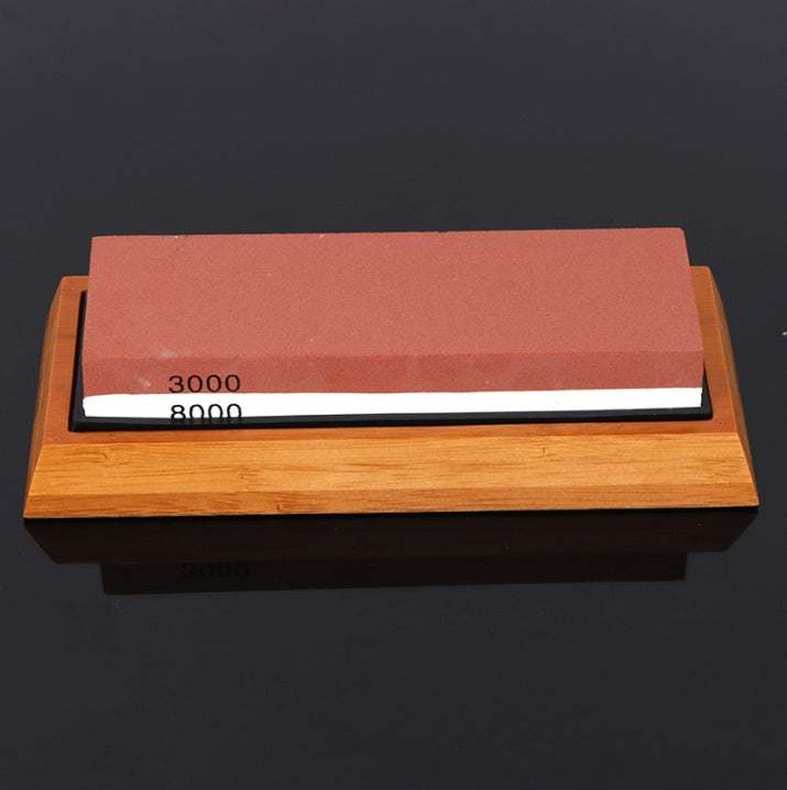 Home kitchen whetstone with bamboo base, featuring 3000/8000 grit white corundum for knife sharpening.