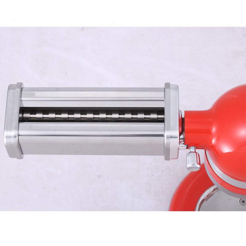 Stainless steel pasta machine attachment on red mixer, durable and easy to clean.