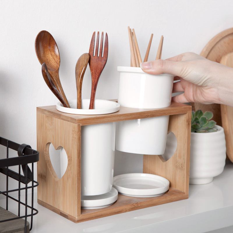 Nordic household ceramic chopstick holder with bamboo wooden frame for kitchen utensils.