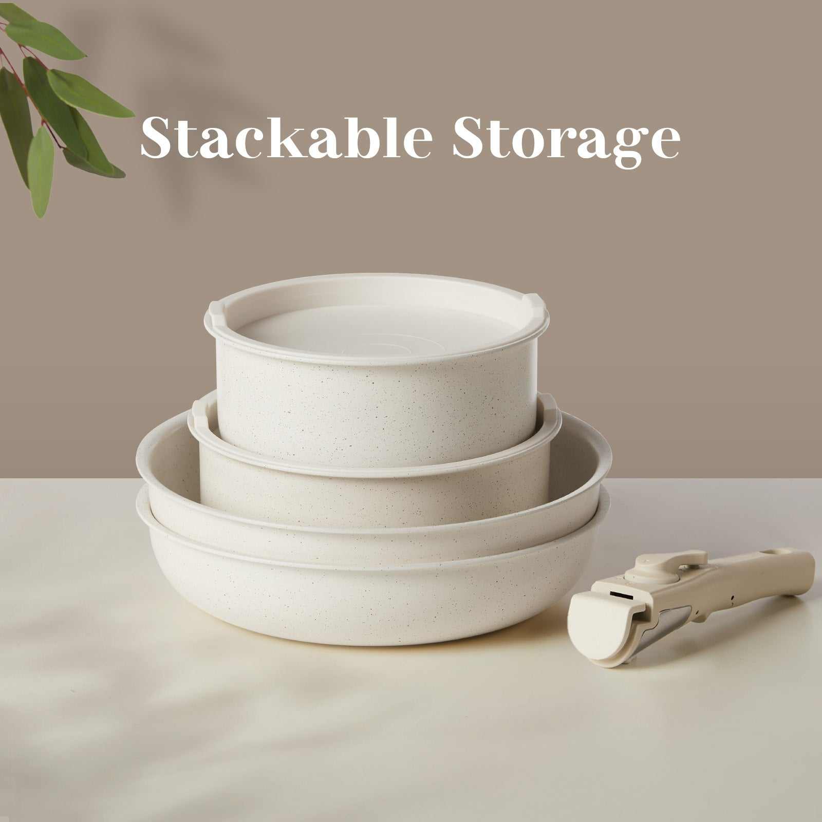 Stackable non-stick granite cookware set with detachable handles, ideal for compact kitchen storage.