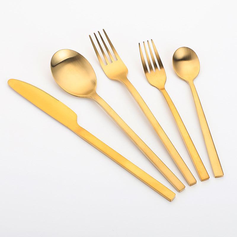 Gold stainless steel cutlery set with matte finish, including knife, fork, and spoon.