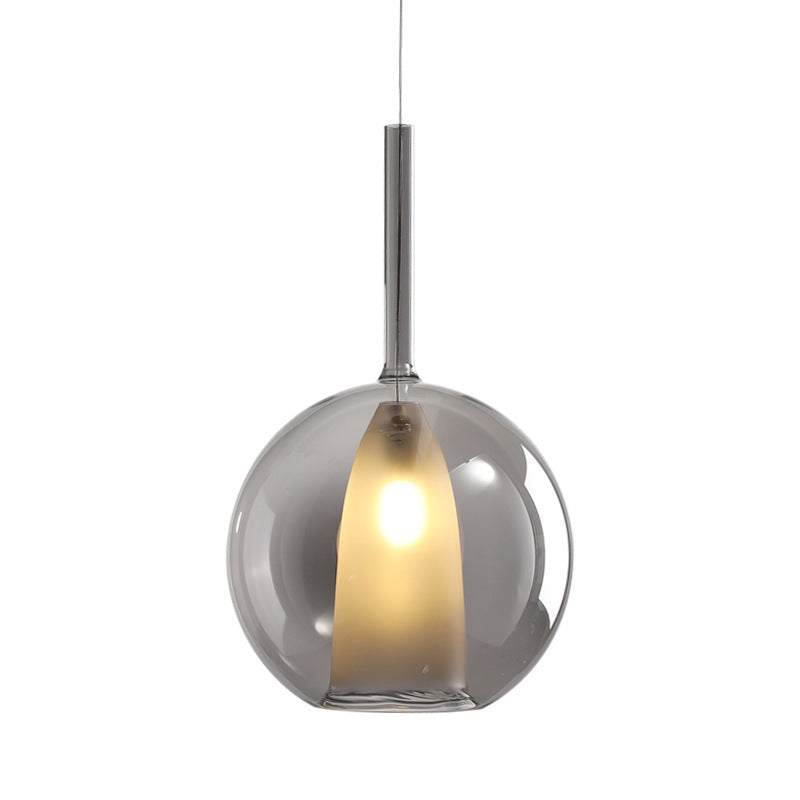 Nordic Creative Staircase long chandelier with transparent globe shade, elegant amber tone.