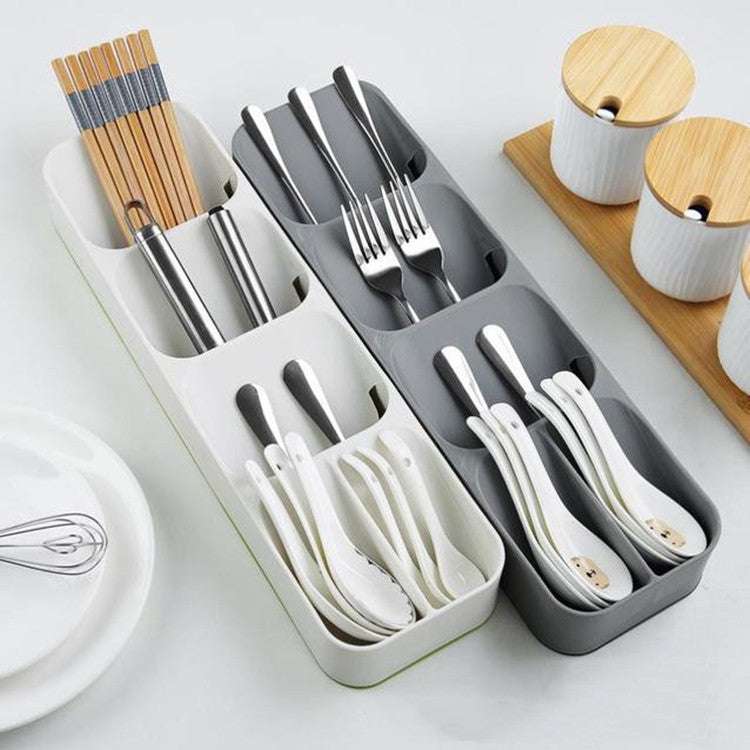 Simple and stylish kitchen drawer cutlery storage box in white and gray, featuring separate compartments for organizing utensils.