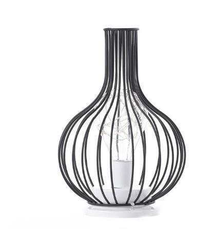 Minimalist hollow table lamp with creative iron design.