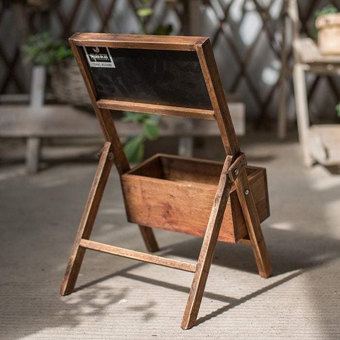 Medium wooden flower box with small blackboard, ideal for garden decorations.
