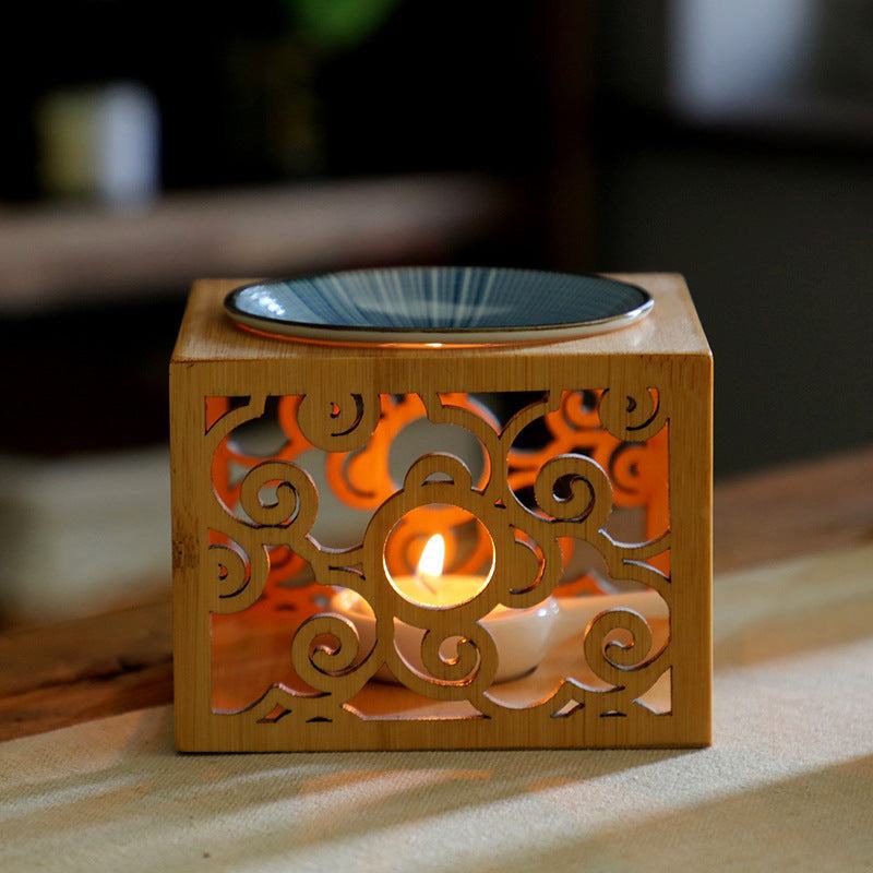Bamboo candle lamp with ceramic oil dish for aromatherapy.