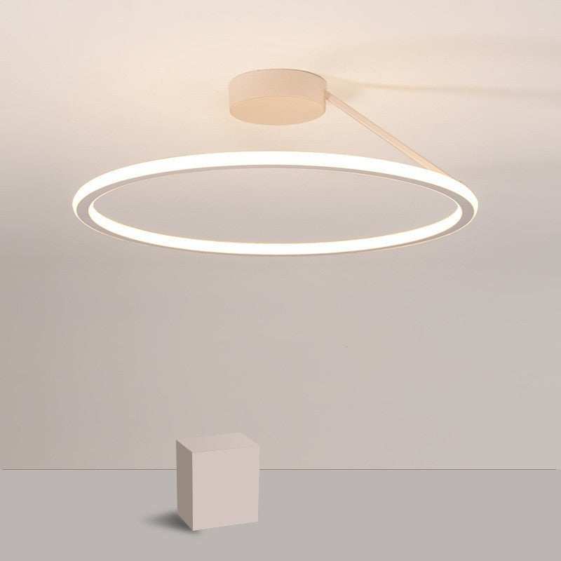 Simple modern LED ceiling light in a minimalist round design with white light.