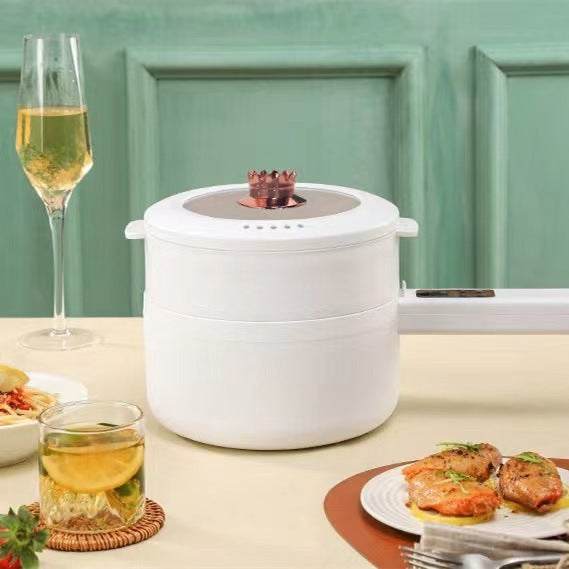 Multifunctional electric cooker in a student dormitory setting, featuring a non-stick pot for easy cleaning and versatile cooking.