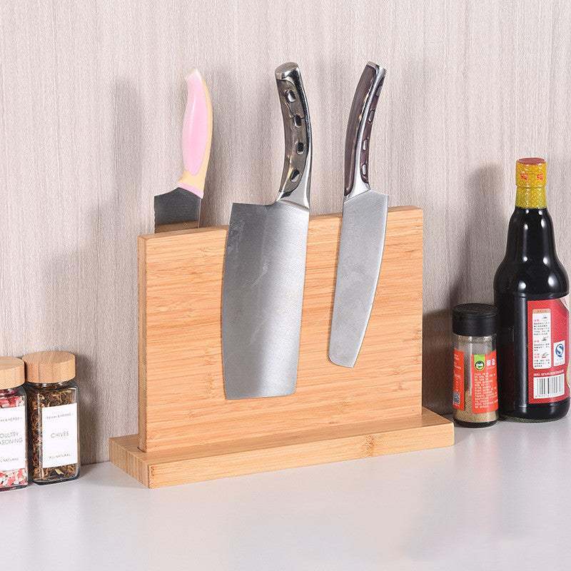 Wall-mounted bamboo magnet knife holder displaying knives in a modern kitchen setting.
