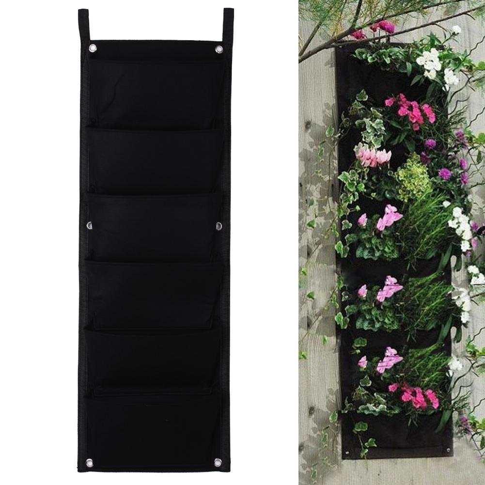 Wall garden hanging planting bags with multiple pockets for vertical gardening, perfect for indoor and outdoor use.