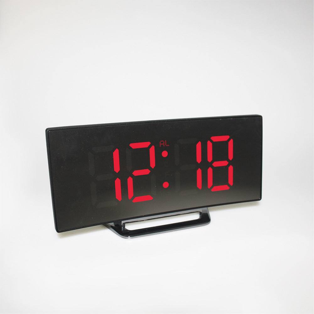 LED alarm clock displaying time, featuring a sleek black design with dual USB charging ports.
