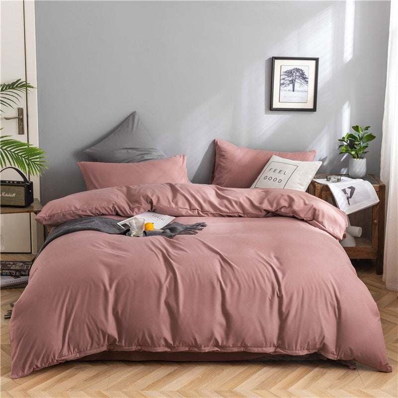 Modern minimalist washed cotton bedding set with geometric pattern on bed in cozy room.