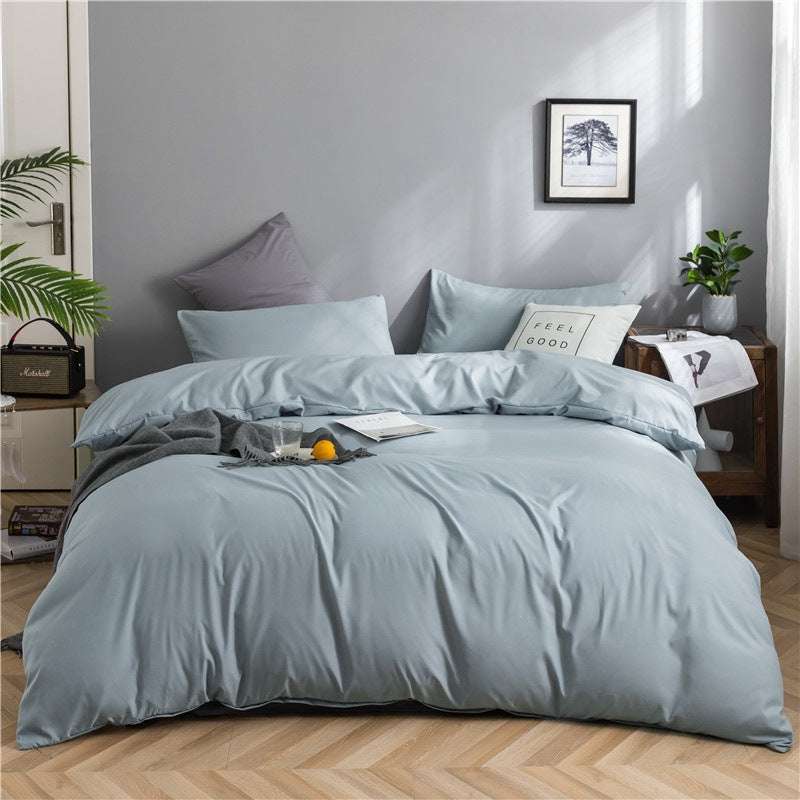 Modern minimalist washed cotton four-piece bedding set with geometric pattern and fitted sheet on 1.8m bed.