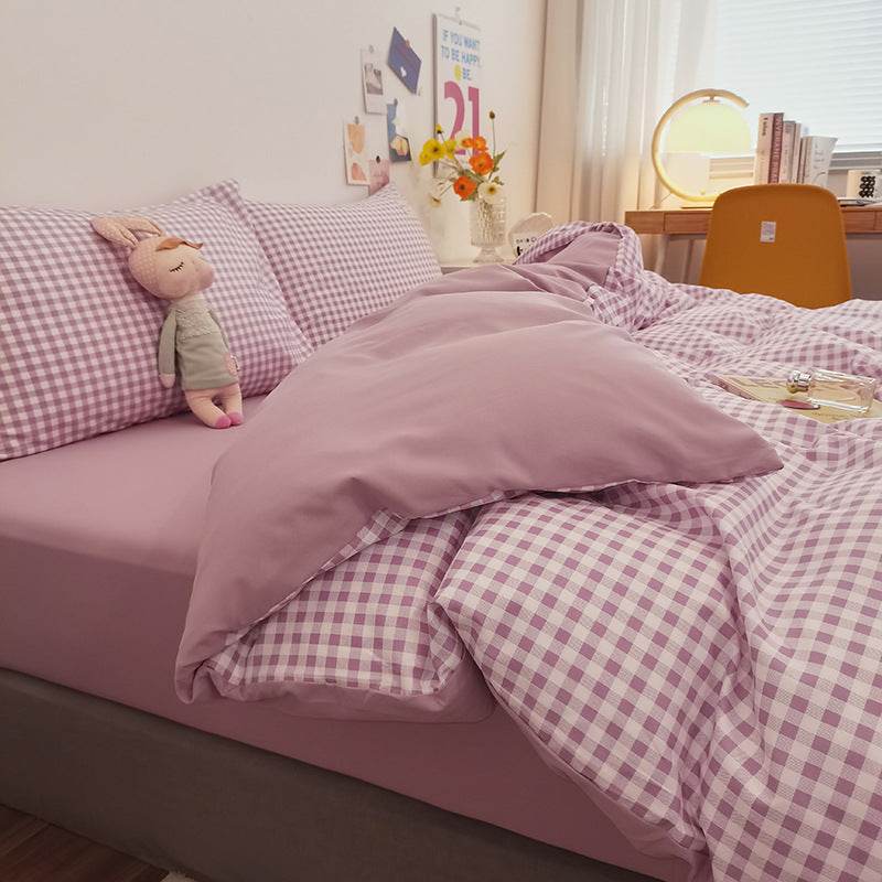 Modern minimalist washed cotton bedding set with geometric pattern on bed.