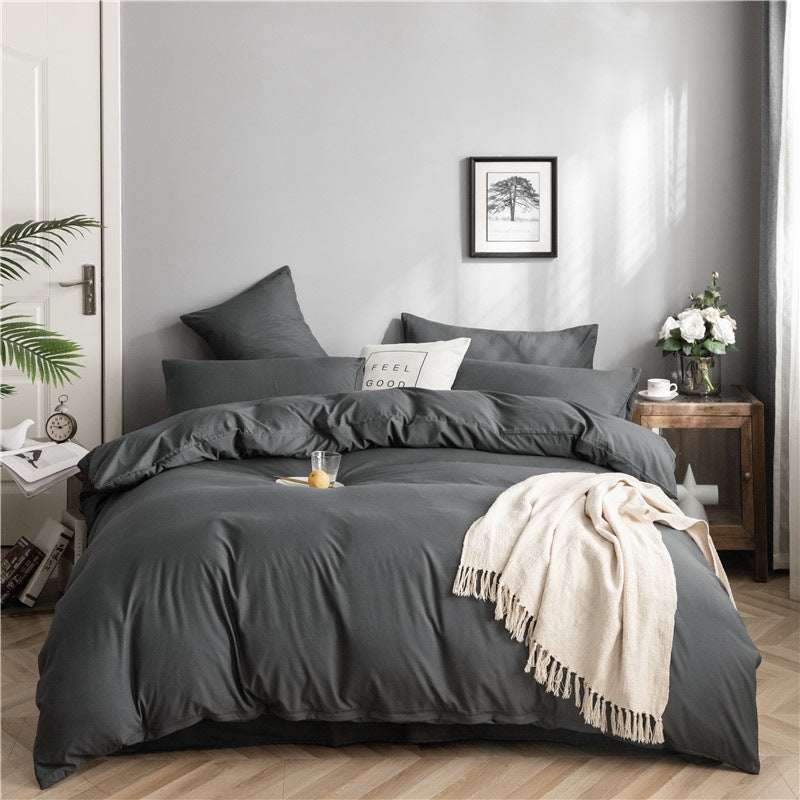 Modern minimalist washed cotton bedding set with geometric pattern in a fitted style on a neatly made bed.