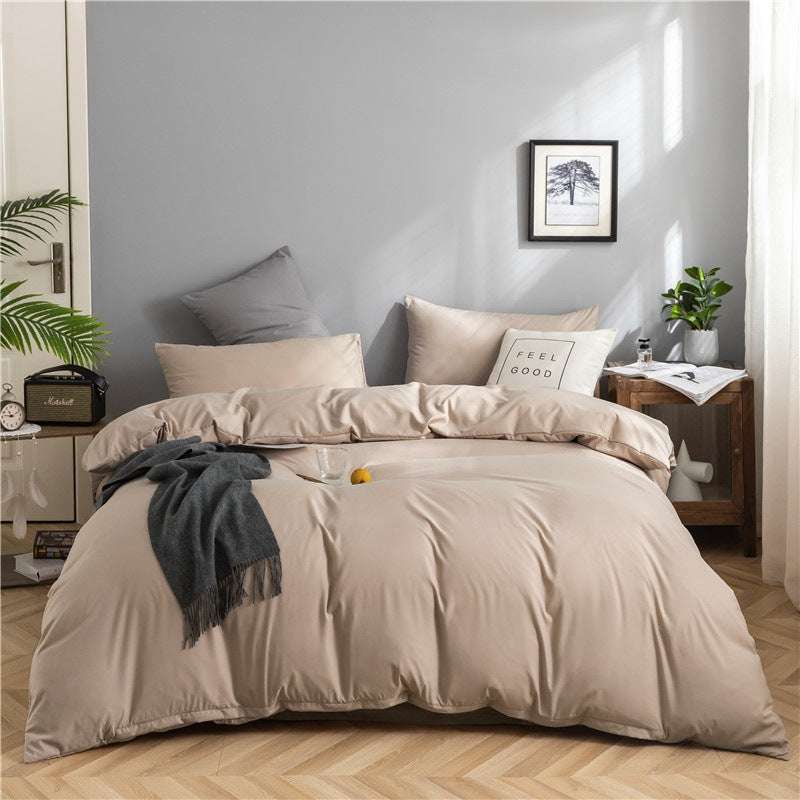 Modern minimalist washed cotton bedding set on bed with geometric pattern and beige color.