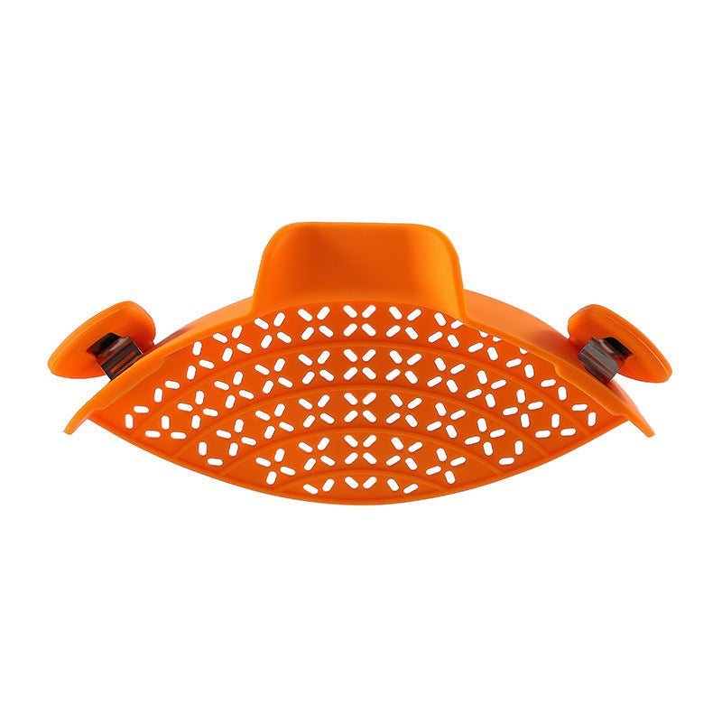 Modern minimalist orange silicone pot side drain stopper with stainless steel, spill-proof kitchen gadget.