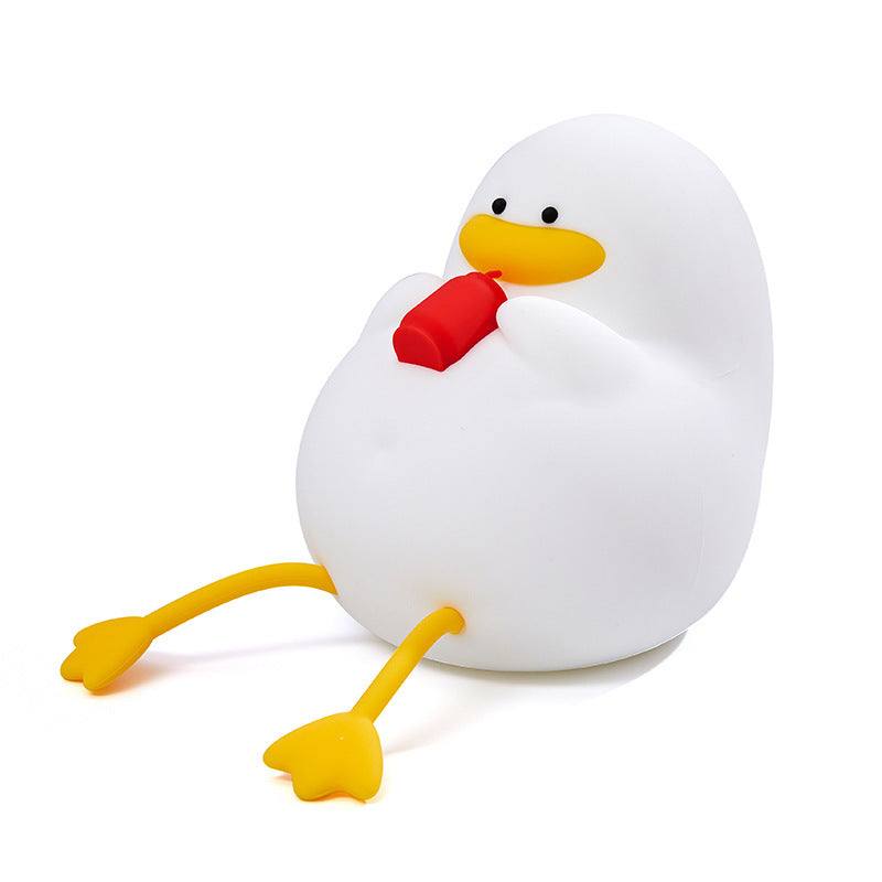 Cute duck-shaped night lamp with flexible silicone material and bright LED glow. 