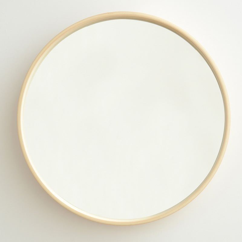 Round solid wood bathroom mirror with a modern and simple design.