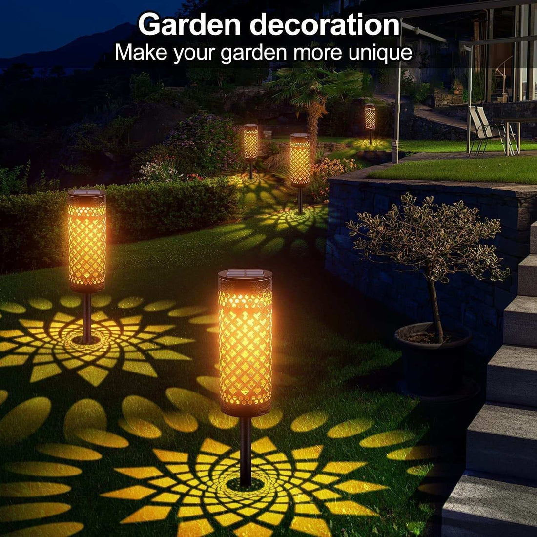 Metal solar-powered lawn lamps illuminating garden with warm light at night, showcasing geometric patterns.