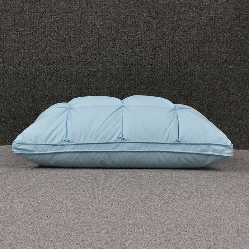 Rectangular white goose down cotton pillow on gray surface.